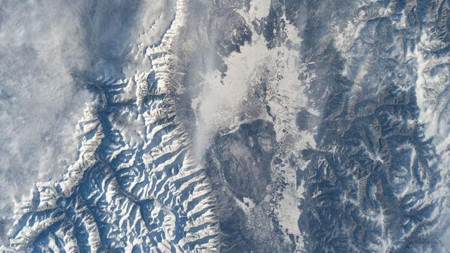 NASA image: The frozen Irkut River runs through Tunkinskiy National Park in southern Siberia