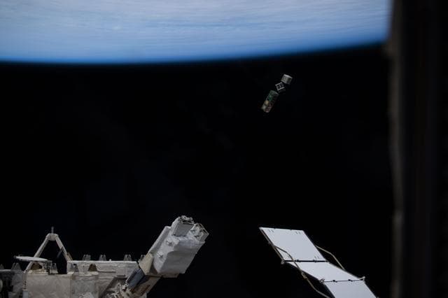 NASA image: A trio of CubeSats is deployed into Earth orbit outside of the International Space Station