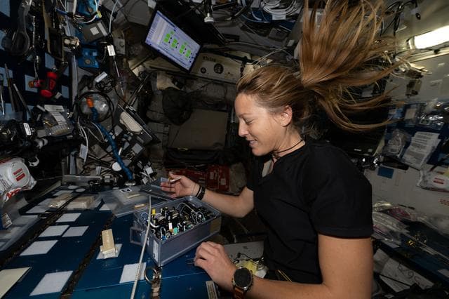 NASA image: ESA astronaut Sophie Adenot installs research components inside the Advanced Space Experiment Processor‑2