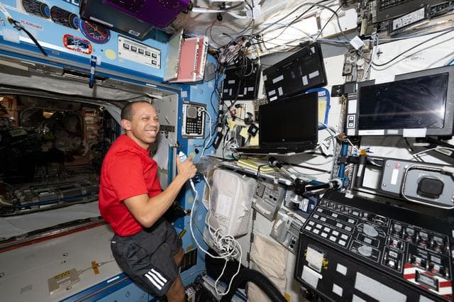 NASA image: NASA astronaut Chris Williams calls down to mission controllers during Crew Medical Officer training 