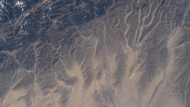 The far western edge of the Taklamakan Desert meets the Pamir Mountains in China