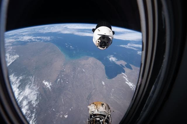 NASA image: A SpaceX Dragon spacecraft backs away from the International Space Station