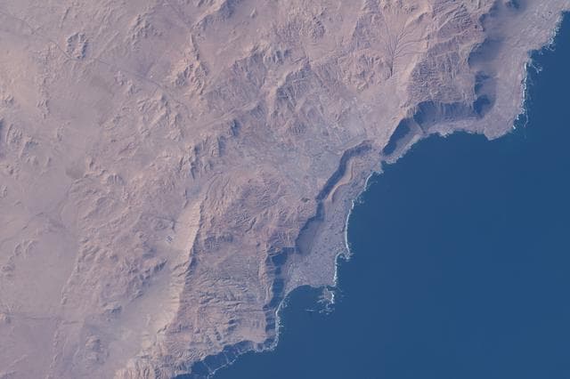 NASA image: Iquique, Chile, at the base of a steep coastal slope just west of the Atacama Desert