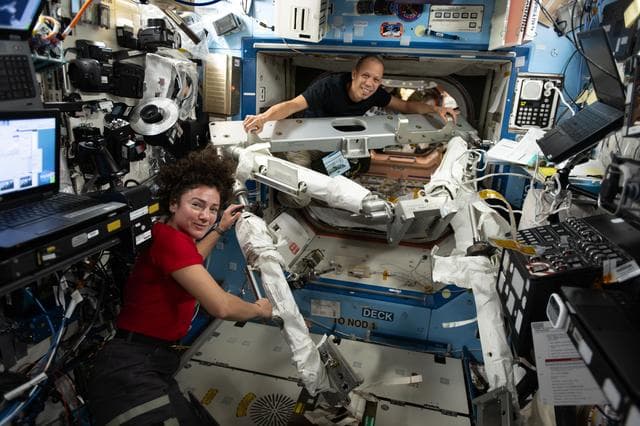 NASA image: NASA astronauts Jessica Meir and Chris Williams familiarize themselves with spacewalking hardware 
