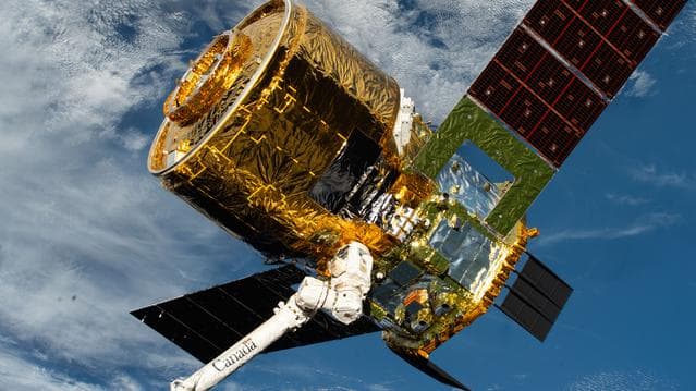 NASA image: The HTV‑X1 cargo spacecraft from JAXA is grasped by the Canadarm2 robotic arm