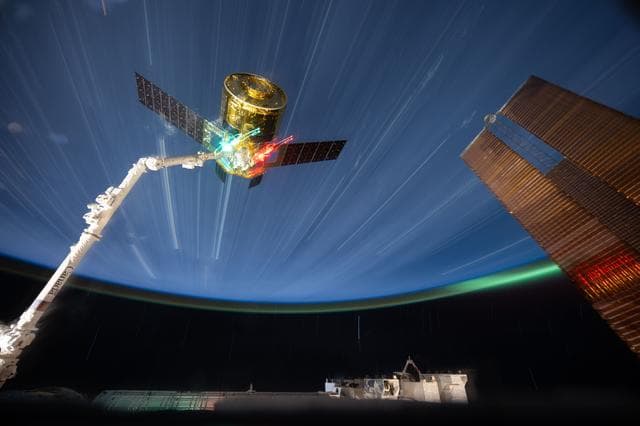 NASA image: The HTV‑X1 cargo spacecraft from JAXA is grasped by the Canadarm2 robotic arm