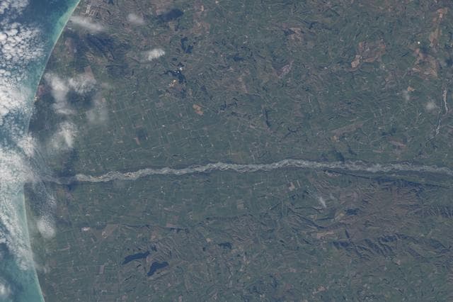 NASA image: The Waitaki River separates New Zealand’s Otago Region from the Canterbury Region