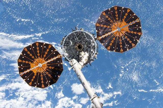 NASA image: The Cygnus XL cargo spacecraft is in the grasp of the Canadarm2 robotic arm