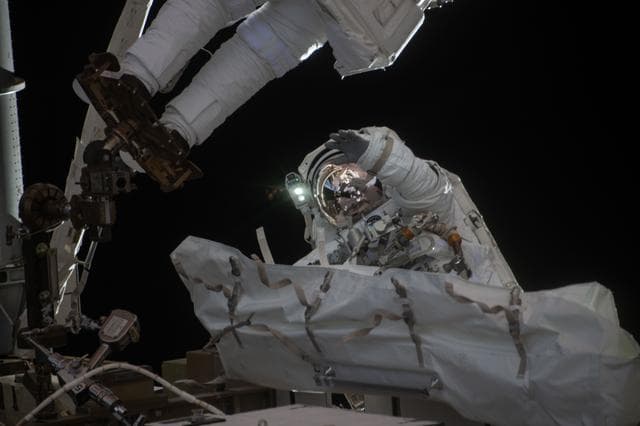 NASA image: NASA astronaut Jessica Meir waves at the camera during a spacewalk