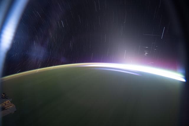 NASA image: Star trails and an orbital sunrise above the southern Indian Ocean