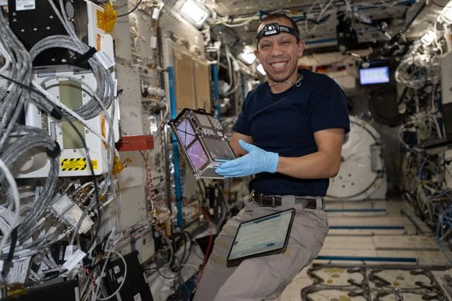 NASA image: NASA astronaut Chris Williams shows off biology research hardware