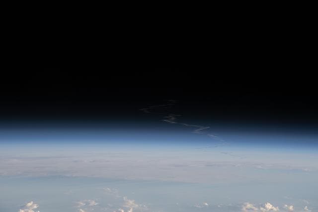 NASA image: The exhaust plume left behind by Artemis II is pictured from the International Space Station