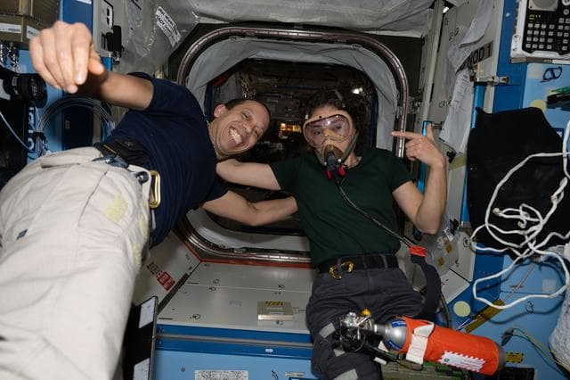 NASA image: NASA astronauts Chris Williams and Jessica Meir pose for a portrait