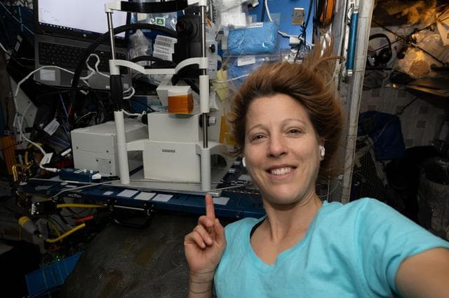NASA image: ESA astronaut Sophie Adenot shows off the Optical Coherence Tomography machine