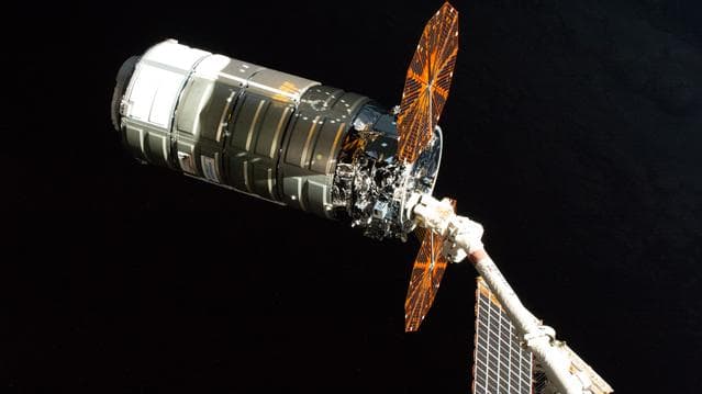 NASA image: The Cygnus XL cargo spacecraft is pictured in the grips of the Canadarm2 robotic arm