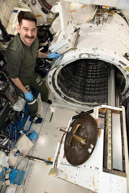 NASA image: Astronaut Jack Hathaway installs the NanoRacks External Platform carrying three scientific payloads