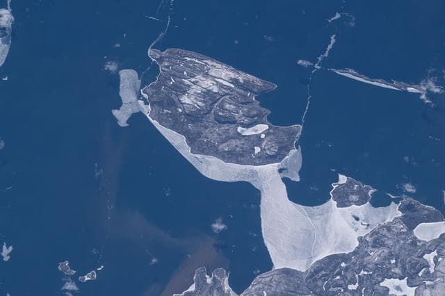 NASA image: Canada’s uninhabited Pie Island surrounded by partial ice cover