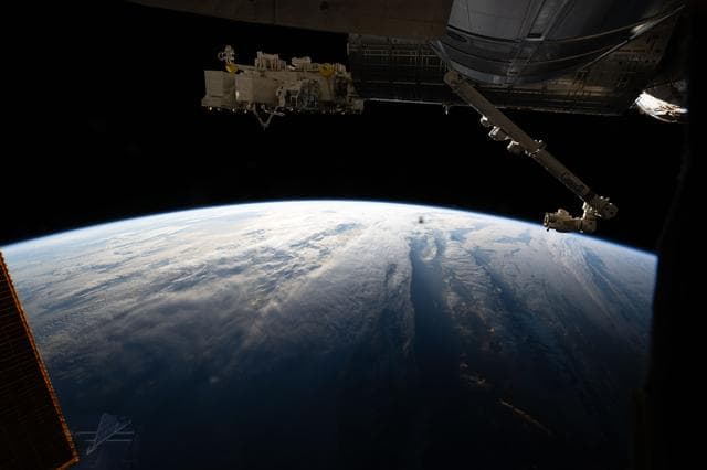 NASA image: The International Space Station orbits above a cloudy Atlantic Ocean