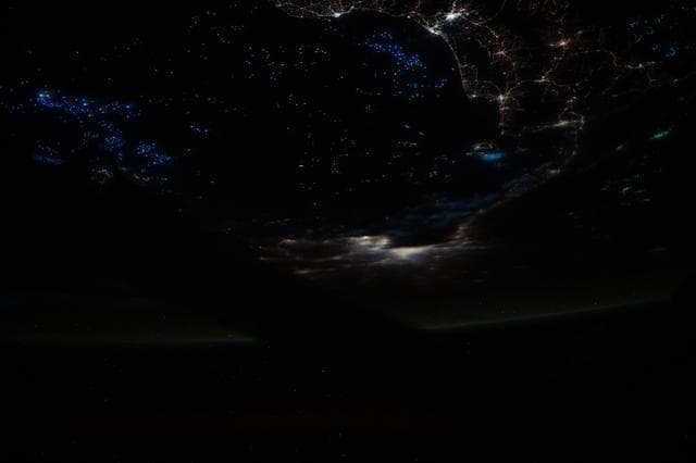 NASA image: The blue lights of fishing boats dot the Gulf of Thailand