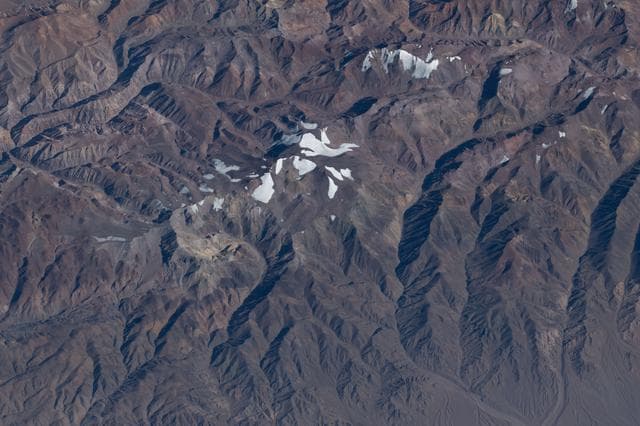 NASA image: Argentina’s snow‑capped Cerro de la Majadita in the Andes Mountains