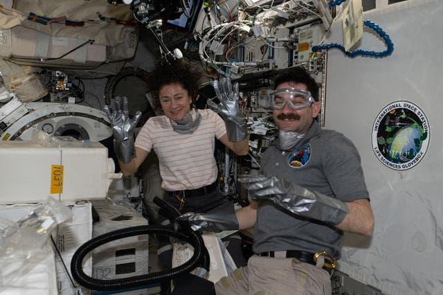 NASA image: NASA astronauts Jessica Meir and Jack Hathaway unpack temperature‑controlled scientific samples