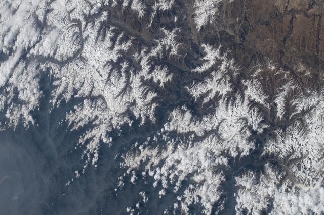 NASA image: The snow‑capped Himalayas separate Nepal from China