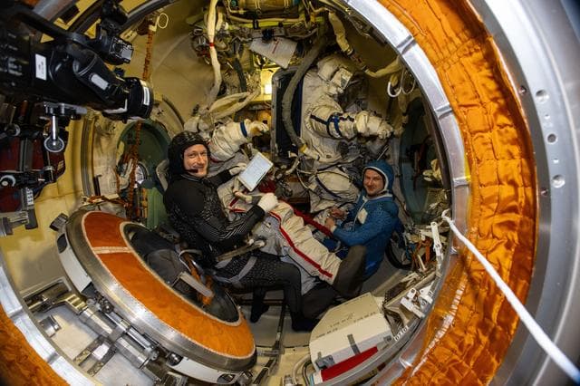 NASA image: Cosmonauts Sergey Kud-Sverchkov and Sergei Mikaev try on their Orlan spacesuits