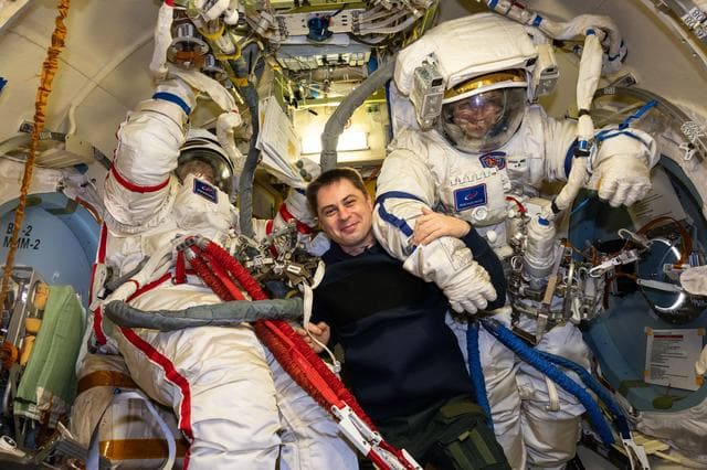 NASA image: Cosmonauts Sergey Kud-Sverchkov and Sergei Mikaev try on their Orlan spacesuits