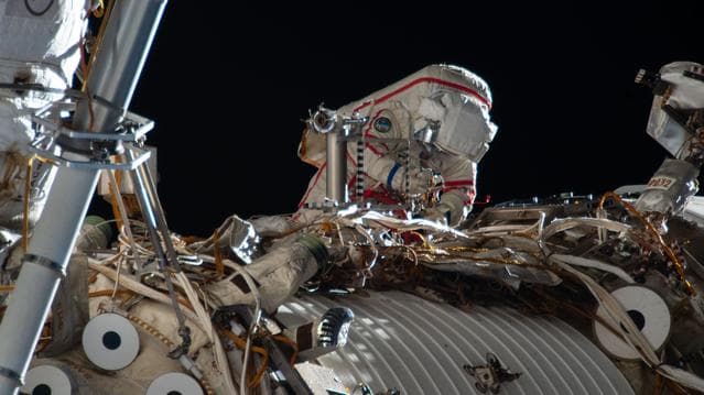 NASA image: Cosmonaut Sergey Kud-Sverchkov works outside the International Space Station in his Orlan spacesuit with red stripes
