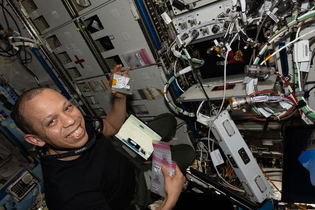 NASA image: NASA astronaut Chris Williams swaps hard drives inside the Advanced Space Experiment Processor-4