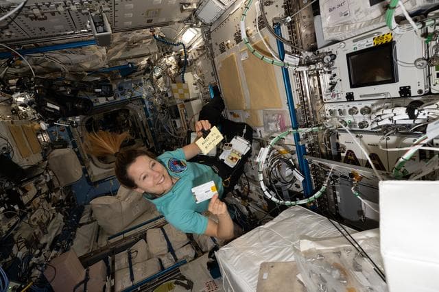 NASA image: ESA astronaut Sophie Adenot swaps hard drives inside the Advanced Space Experiment Processor-4