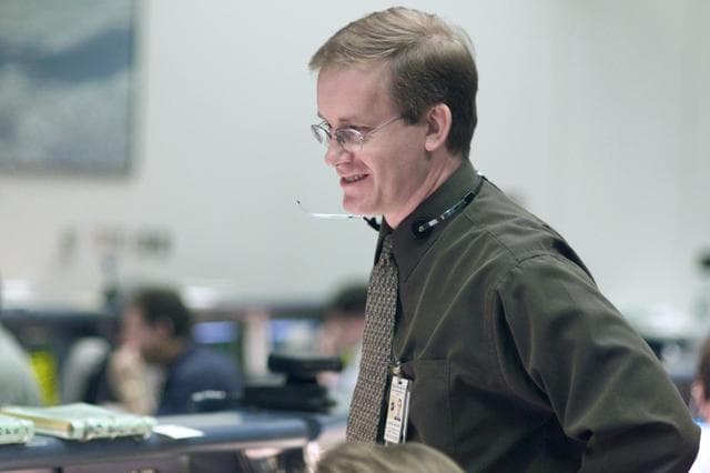 NASA image: STS-105 coverage of Mission Control Center employees in the WFCR & BFCR