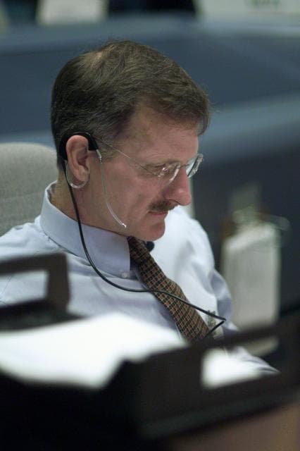 NASA image: STS-105 coverage of Mission Control Center employees in the WFCR & BFCR