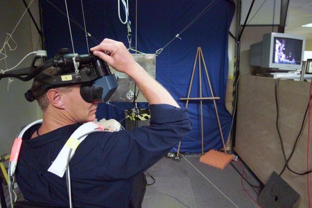 NASA image: Photographic coverage of STS-112 during EVA 3 in VR Lab.