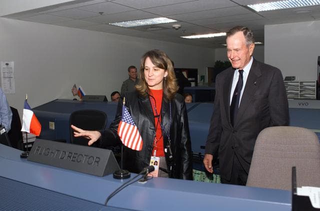 NASA image: Former President George H. W. Bush and Mrs. Bush visit with Mission Control Center personnel.
