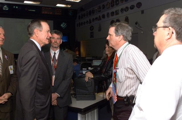 NASA image: Former President George H. W. Bush and Mrs. Bush visit with Mission Control Center personnel.