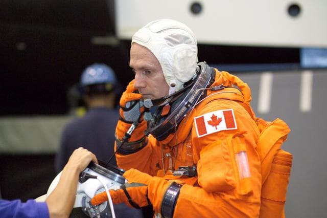 NASA image: STS-115 crew during suited egress training on the Full Fuselage Trainer (FFT) mockup.