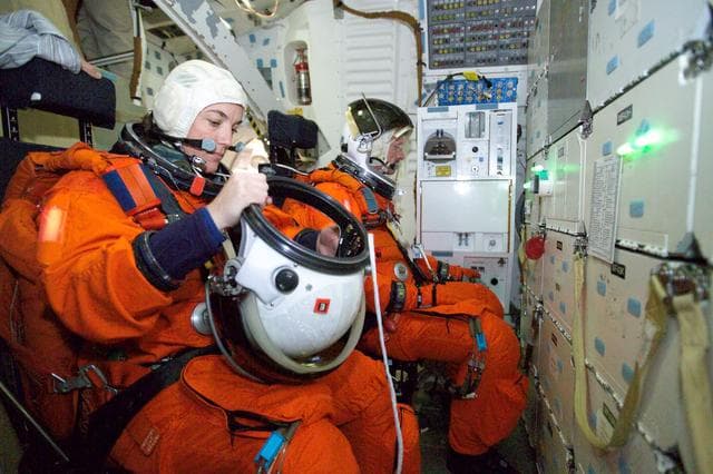 NASA image: STS-115 crew during crew bailout (91020) training in crew compartment trainer.
