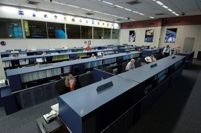 NASA image: Document handover of ISS Flight Control room to new Flight Control Room in old MCC