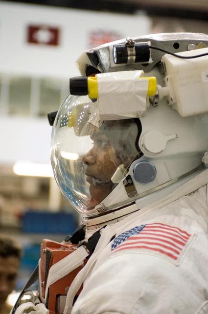 NASA image: STS-116 crew members during EVA training at the NBL.