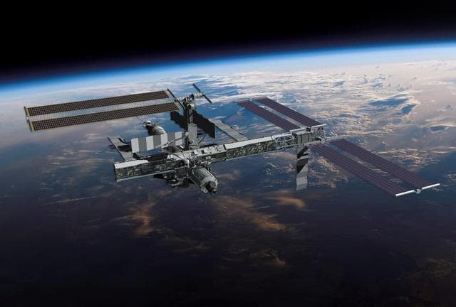 NASA image: Computer generated image of STS-116/12A.1 ISS configuration over earth view