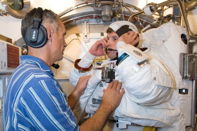 NASA image: Crew Station Airlock Training, STS-117, SSATA Chamber, STB-SS-1810 (Swanson)