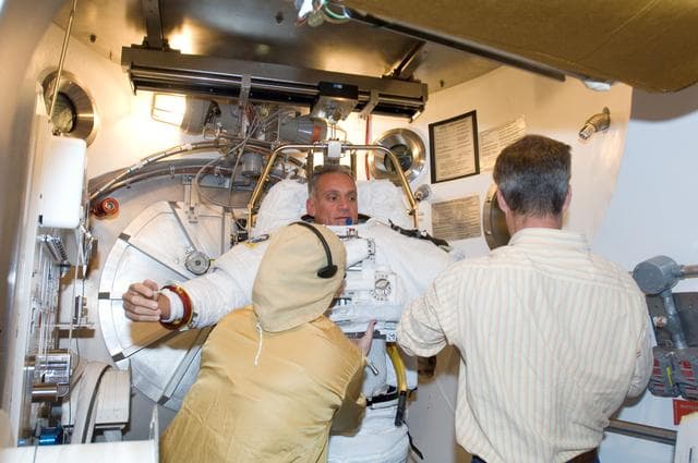 NASA image: Crew Station Airlock Training, STS-117, SSATA Chamber, STB-SS-1810 (Olivas)