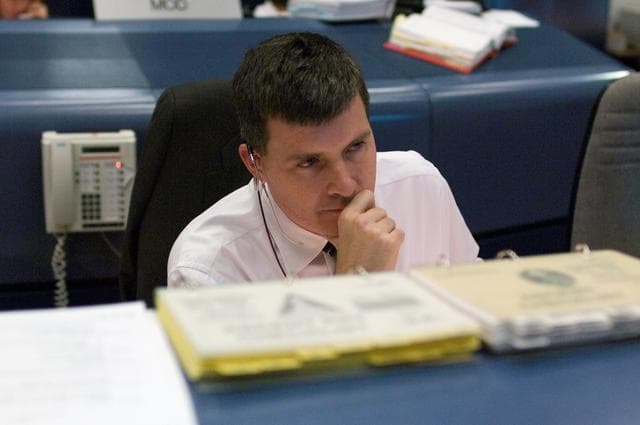 NASA image: STS-116 Flight Controllers on console during mission - (Ascent/Entry Shift)