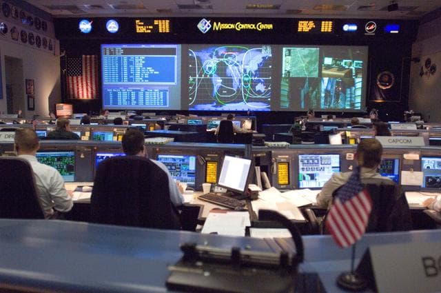 NASA image: STS-116 Flight Controllers on console during mission - (Ascent/Entry Shift)
