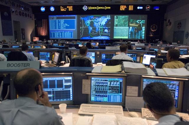 NASA image: STS-116 Flight Controllers on console during mission - (Ascent/Entry Shift)