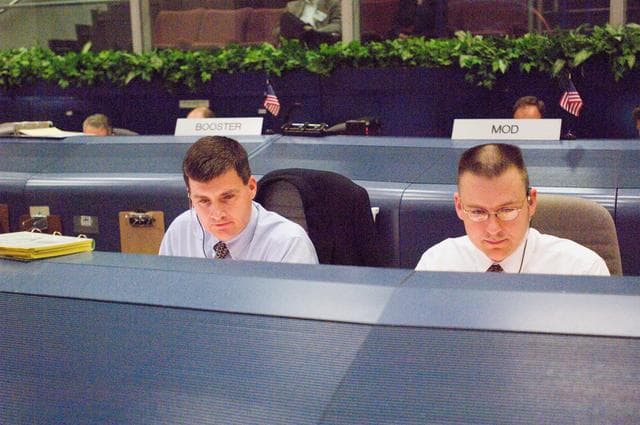 NASA image: STS-116 Flight Controllers on console during mission - (Ascent/Entry Shift)