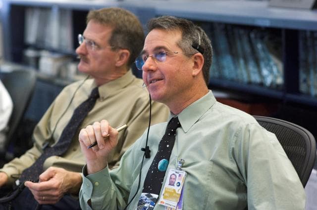 NASA image: STS-116/ISS 12A.1 flight controllers on console during EVA #4