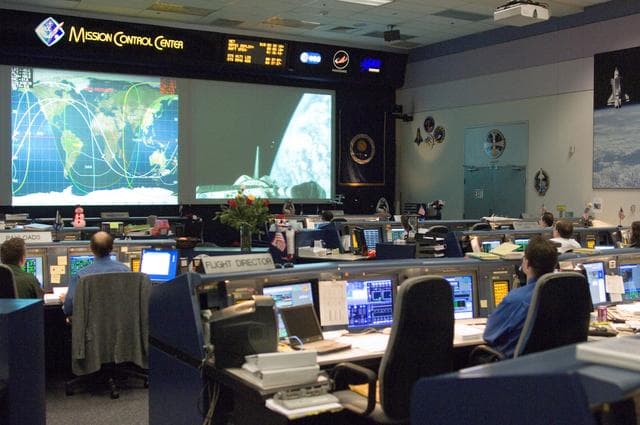 NASA image: STS-116 Flight Controllers on console during mission - WFCR - Orbit 2