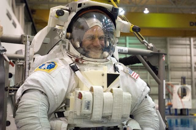 NASA image: STS-122 crew member Stan Love suiting up
